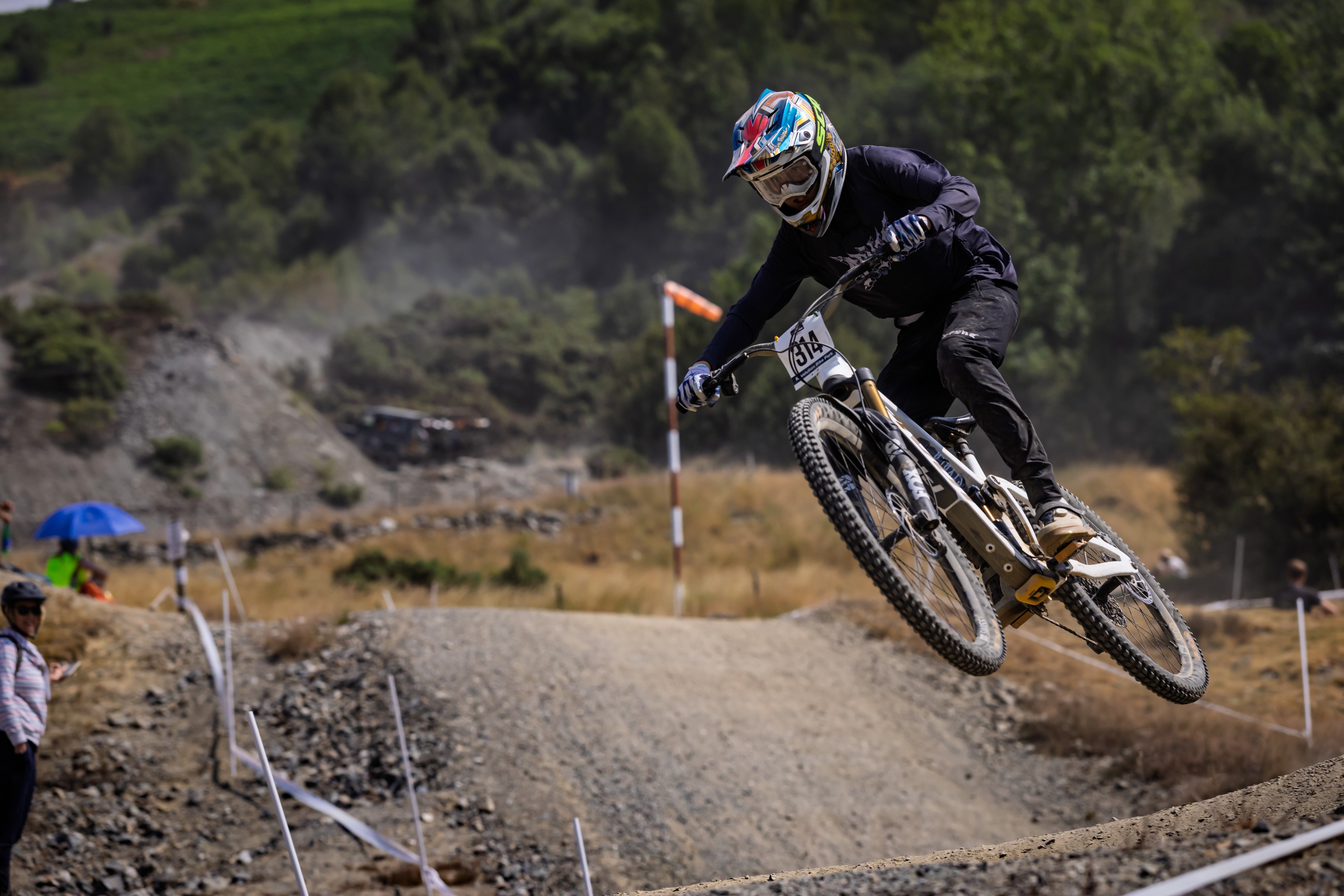 Stanlie Britt racing downhill mountain bike